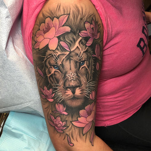 Lion And Flowers Tattoo