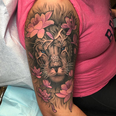 Lion And Flowers Tattoo